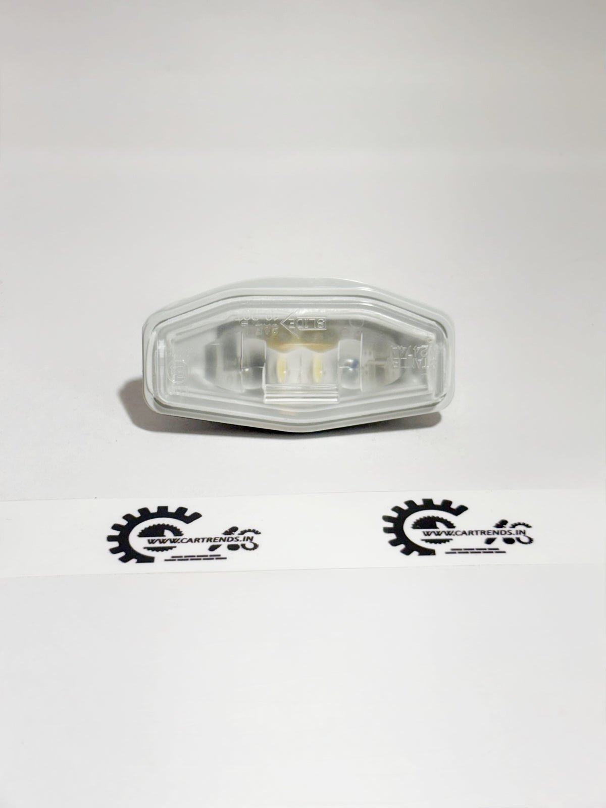 Honda license light assembly, part 34100T9A003, showing the front view of the vehicle's license plate illumination light.