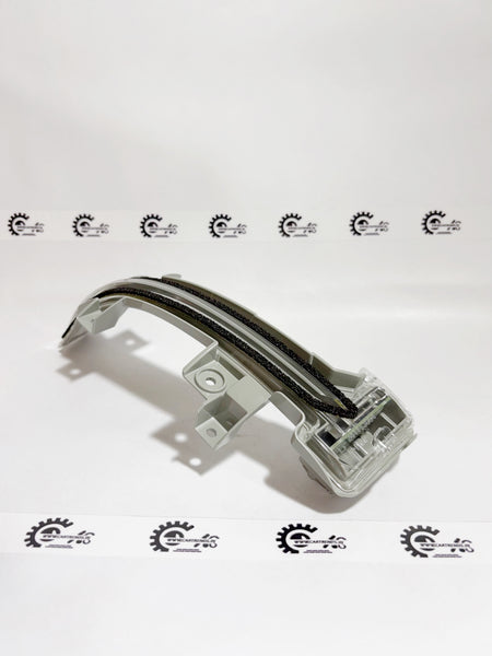 Honda light assembly for right side turn signal, showing the lens and mounting bracket on a white background.
