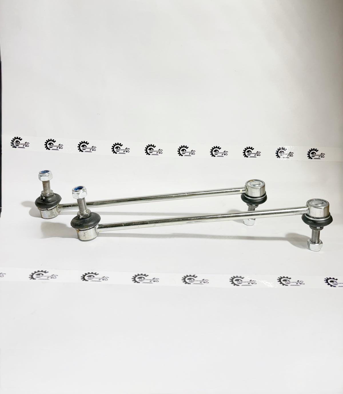 AUTOKOI Nissan Terrano and Renault Duster front stabilizer link set, showing the link rod with mounting points on a white background.
