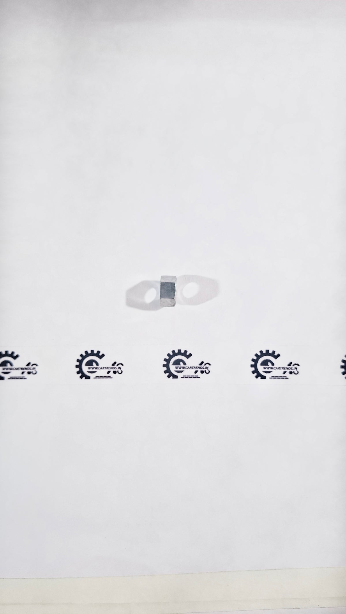 Honda NUT.HEX 12MM 90215TG2003 fastener shown, close-up of the hex nut for motorcycle or vehicle parts.
