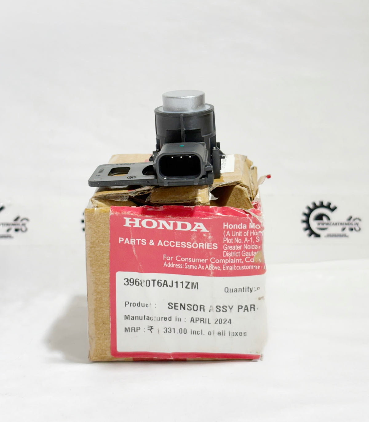 Honda parking sensor assembly with clip, right side view, showing sensor and mounting components.