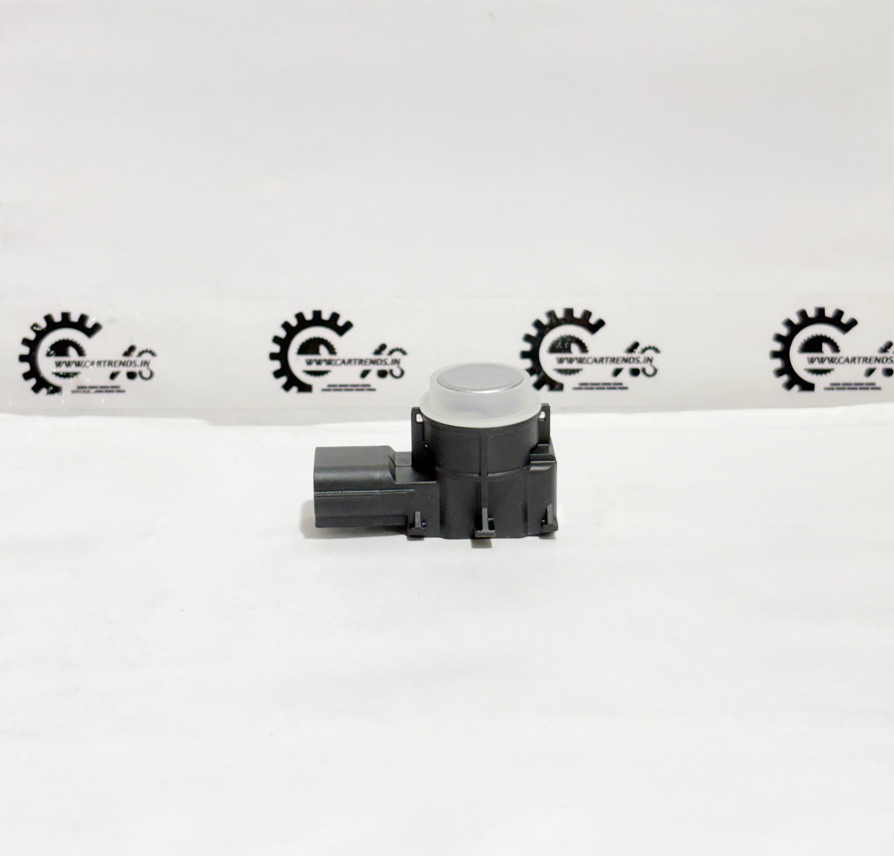 Honda parking sensor assembly, front view, without CL 39680T6AJ01ZM, mounted on vehicle bumper for parking assistance.
