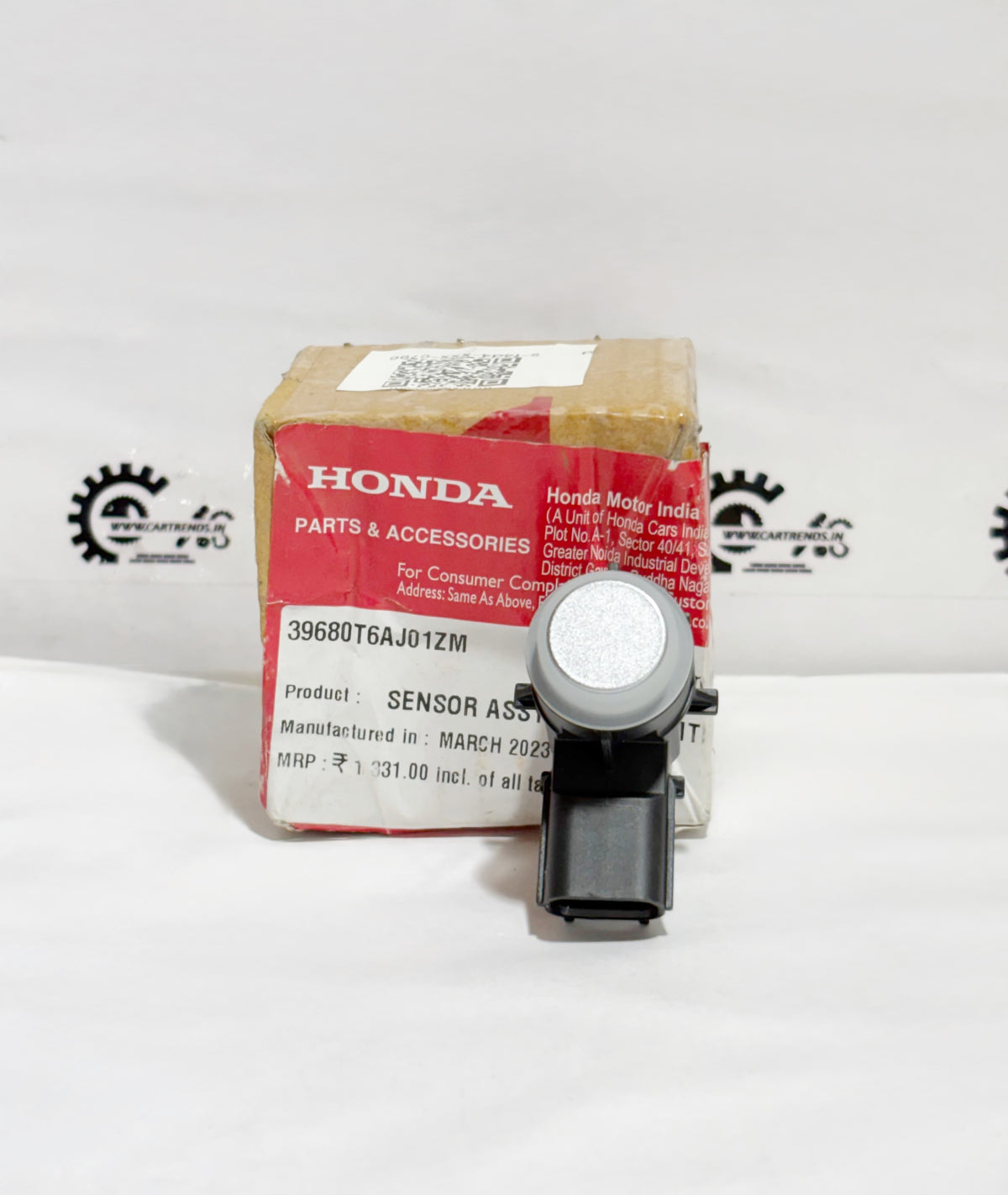 Honda parking sensor assembly showing the left-side sensor with wiring and mounting bracket, designed for Honda vehicles.