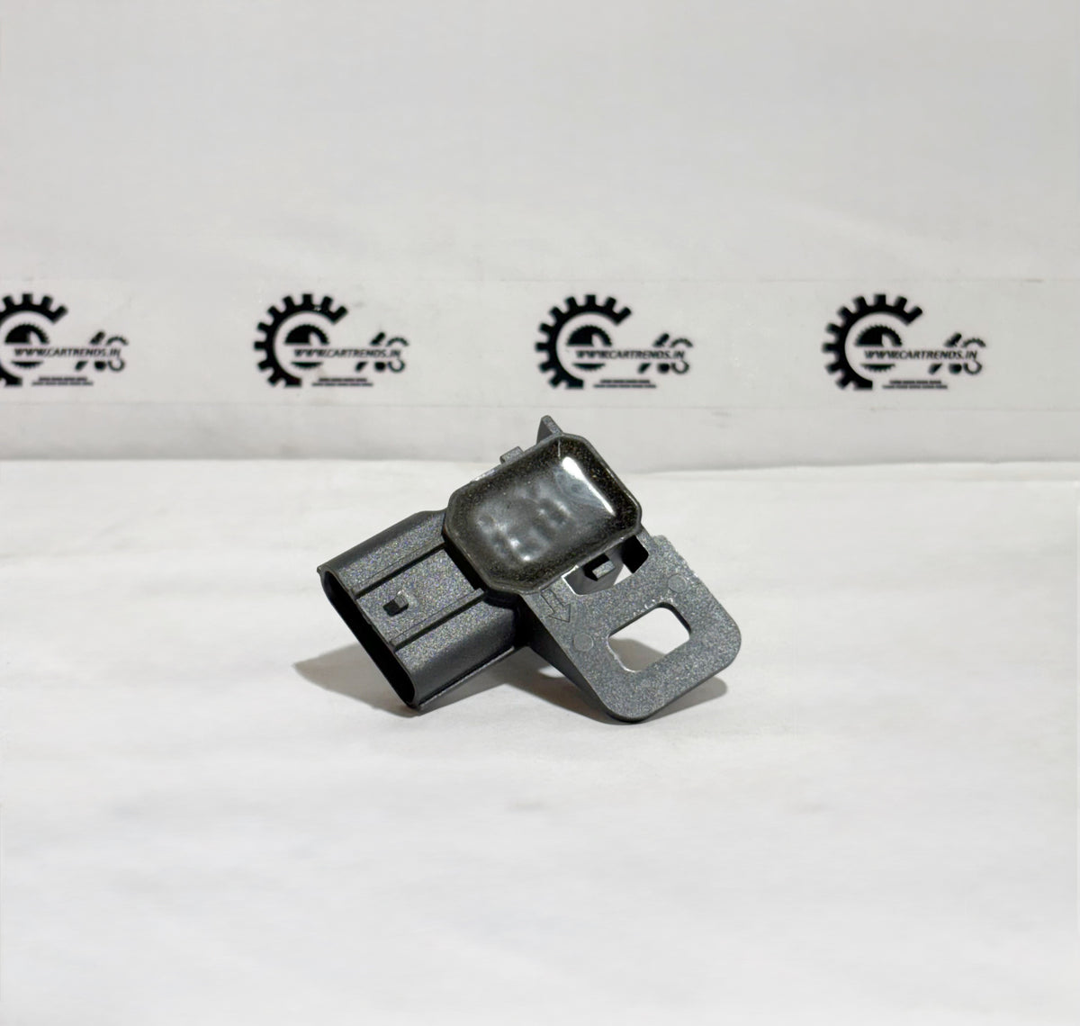 Honda parking sensor assembly with clip, shown from the back, part number 39680TSVW11ZH for vehicle safety and parking assistance.