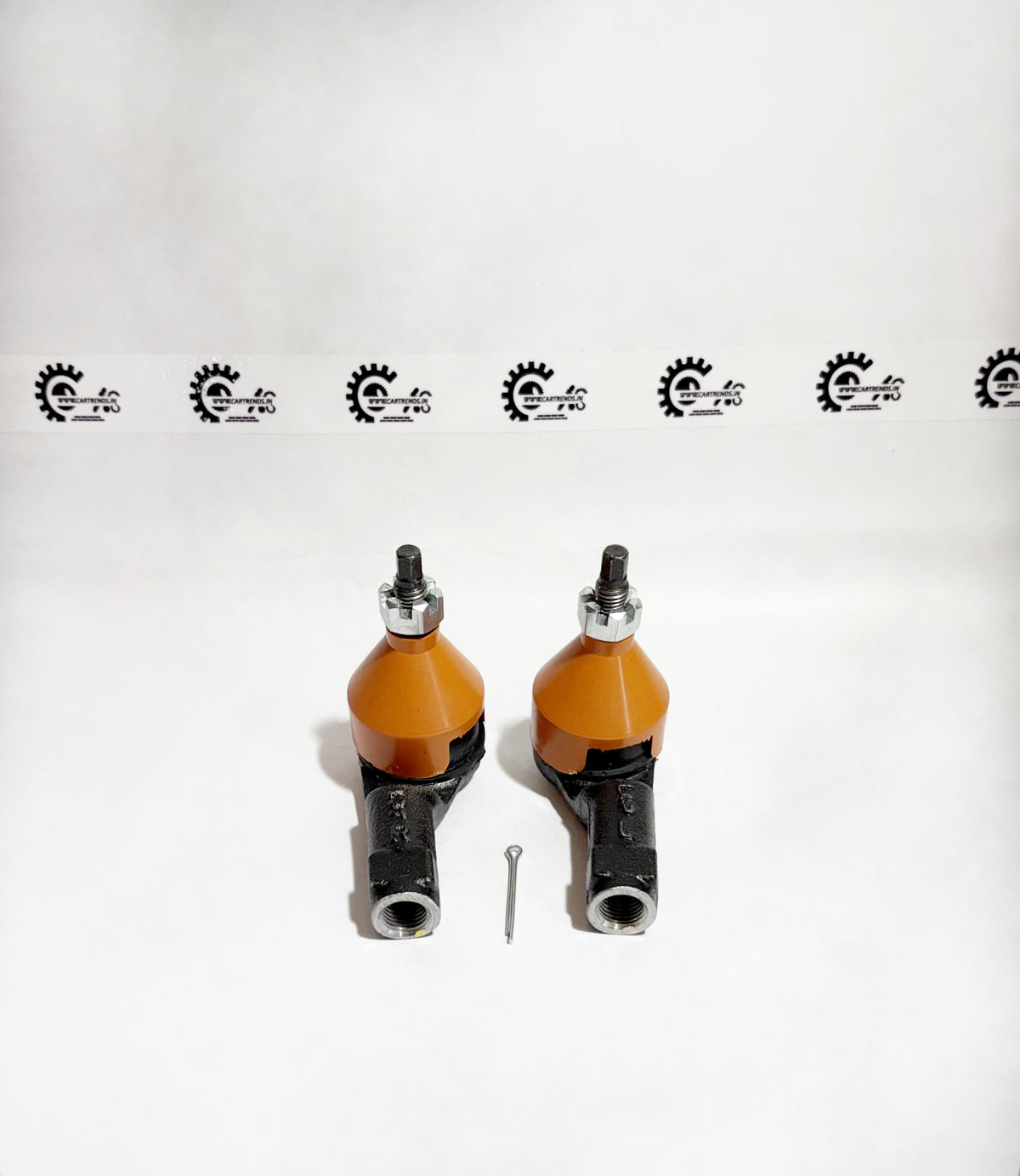 Pair of AUTOKOI tie rod end assemblies for Kia Seltos, showing left and right side components in a car repair setting.