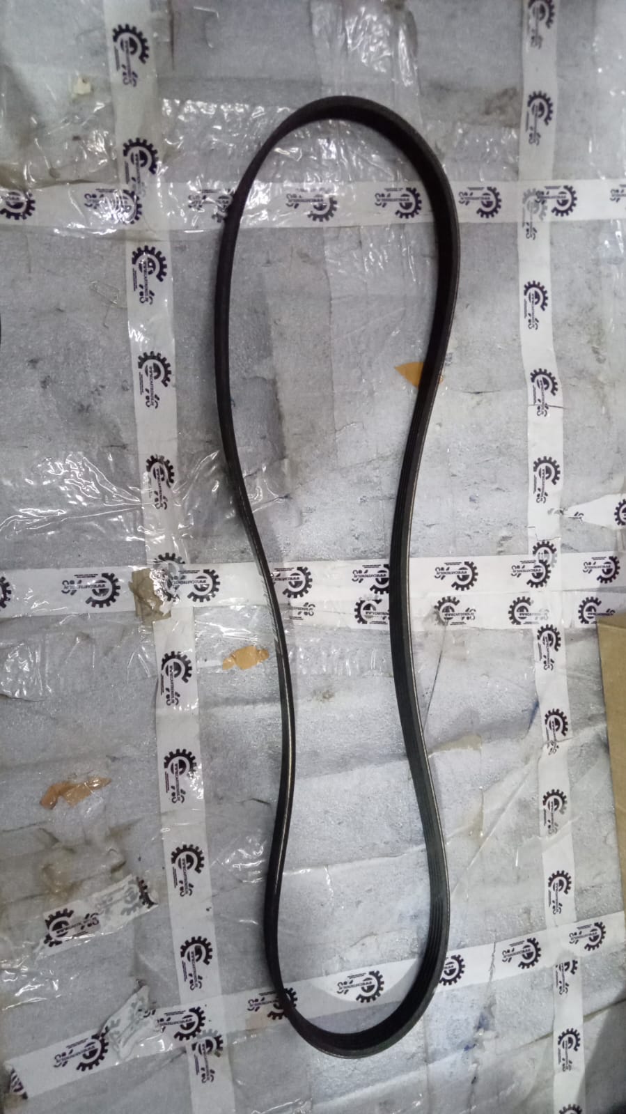 Hyundai I10 spare part Kapa fan belt 2521203000, automotive engine component on a car engine.