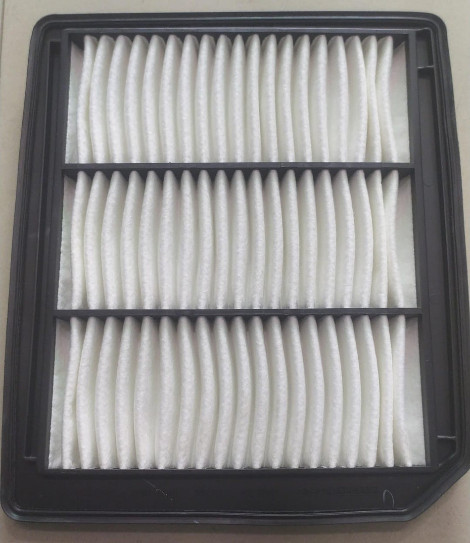Maruti Suzuki Baleno new model air filter 13780M76SA0, showing the rectangular filter with pleated filter material.