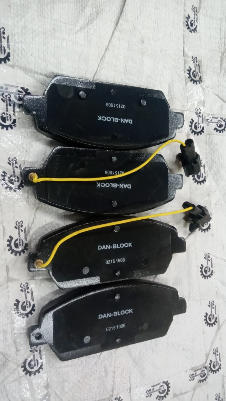 Aftermarket Mahindra XUV 500 brake pad for front brake system, close-up view of the spare part showing surface details.