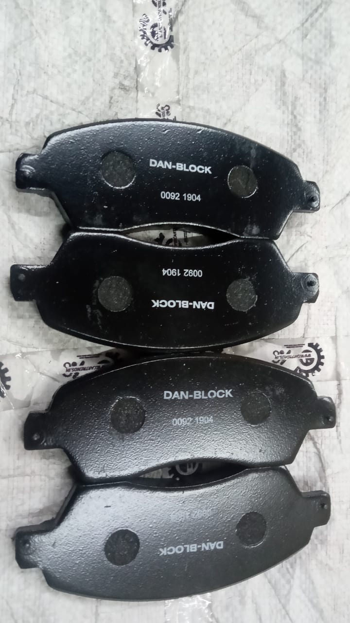 After-market brake pad for Mahindra Scorpio, new model spare part, close-up view of the brake pad showing surface details.