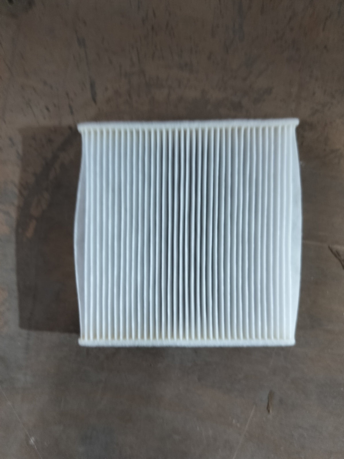 Aftermarket AC filter Swift NM 95861M74L00TL installed in vehicle for improved air quality and system performance