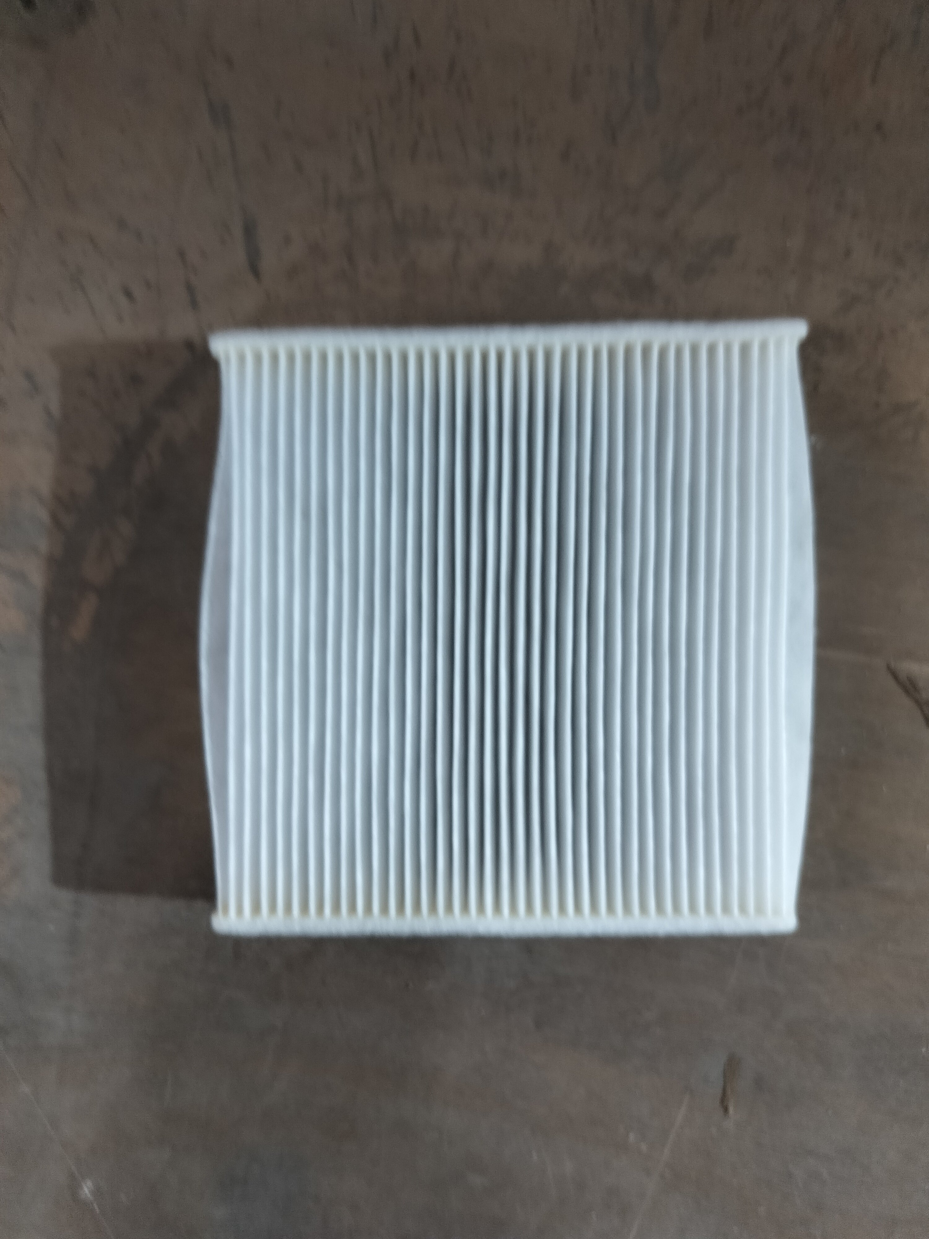 Aftermarket AC filter Swift NM 95861M74L00TL installed in vehicle for improved air quality and system performance