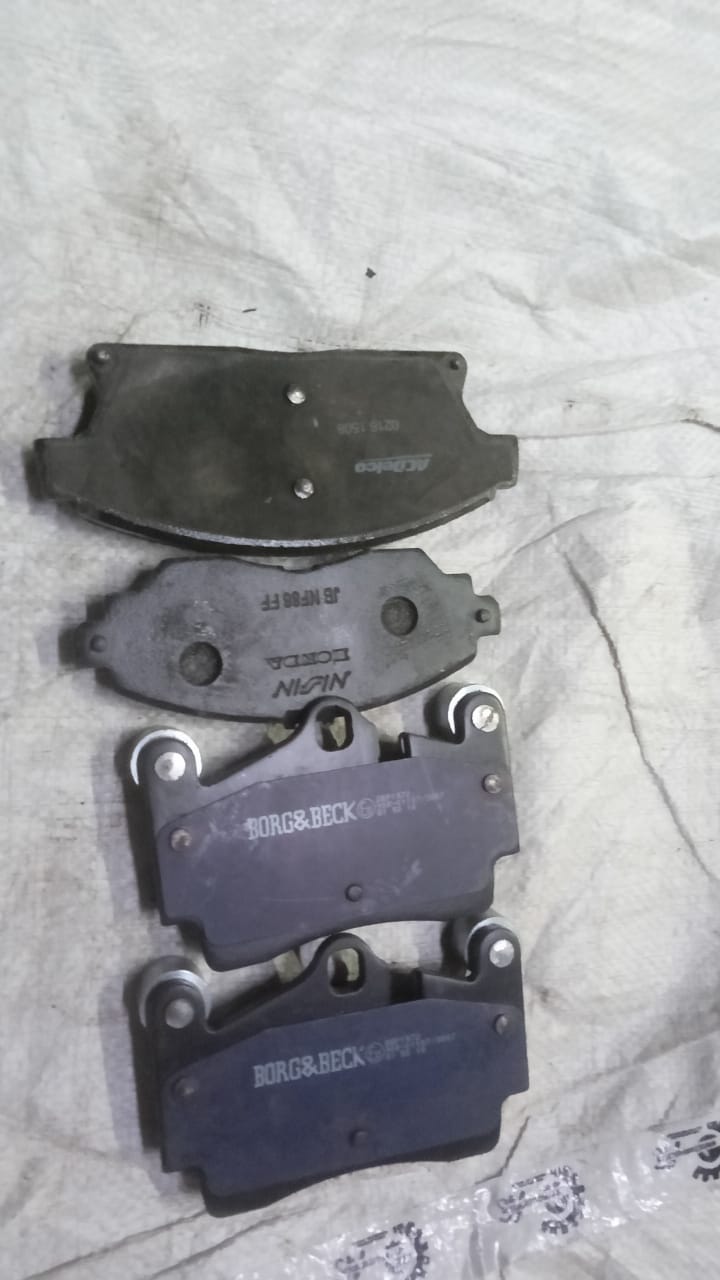 Rear aftermarket brake pad for Audi Q7, branded AFTERMARKET, showing the pad's shape and material in the image.