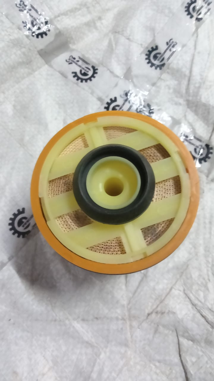 Aftermarket fuel filter for Toyota Etios, part number 233900N090TL, shown in a clear view with its detailed design.