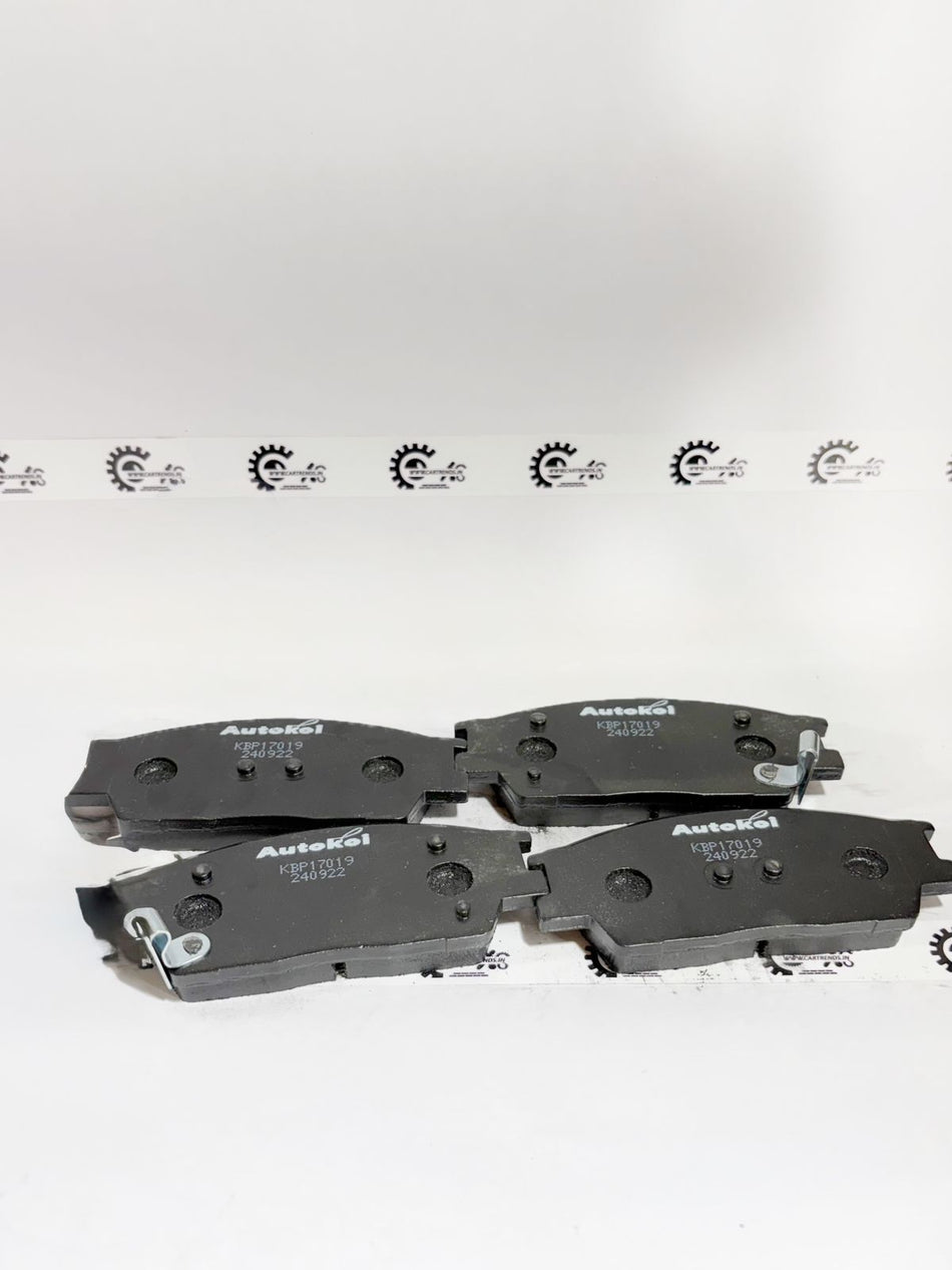 AUTOKOI brake pads and shoe model KBPF17019, automotive brake components with detailed surface texture and packaging.