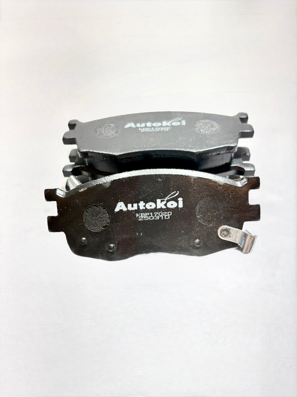 AUTOKOI brake pads and shoe KBPF17020 installed on vehicle brake system, close-up view of the automotive brake component.