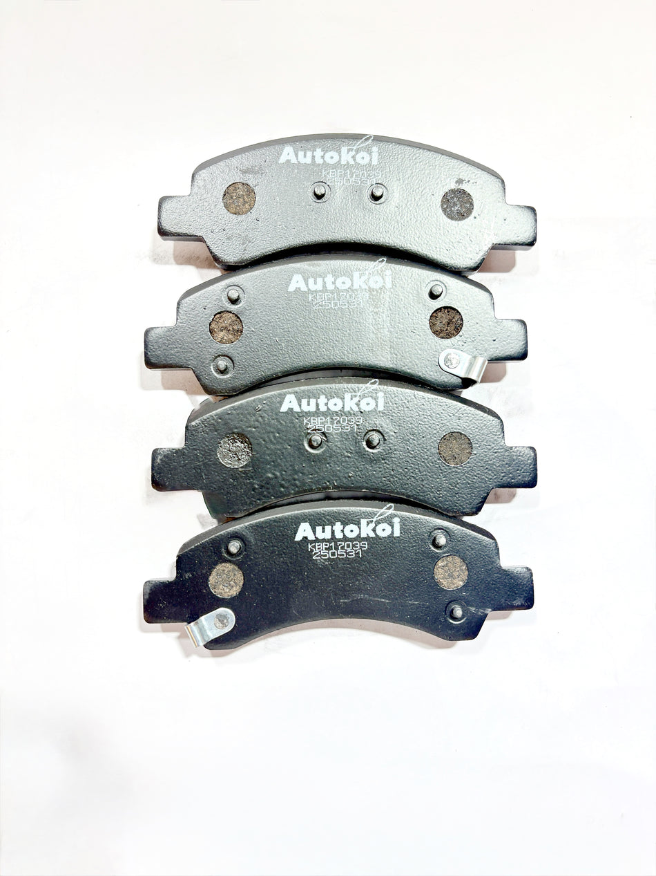 AUTOKOI brake pads and shoe KBPF17039, automotive brake components with detailed surface texture and metallic mounting points.