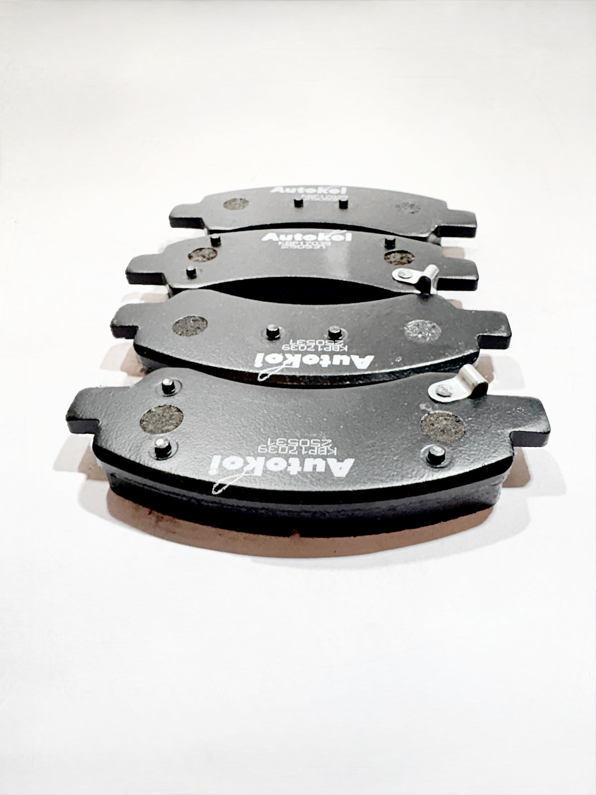 AUTOKOI brake pads and shoe KBPF17039, automotive brake components with detailed metal and friction surface visible.