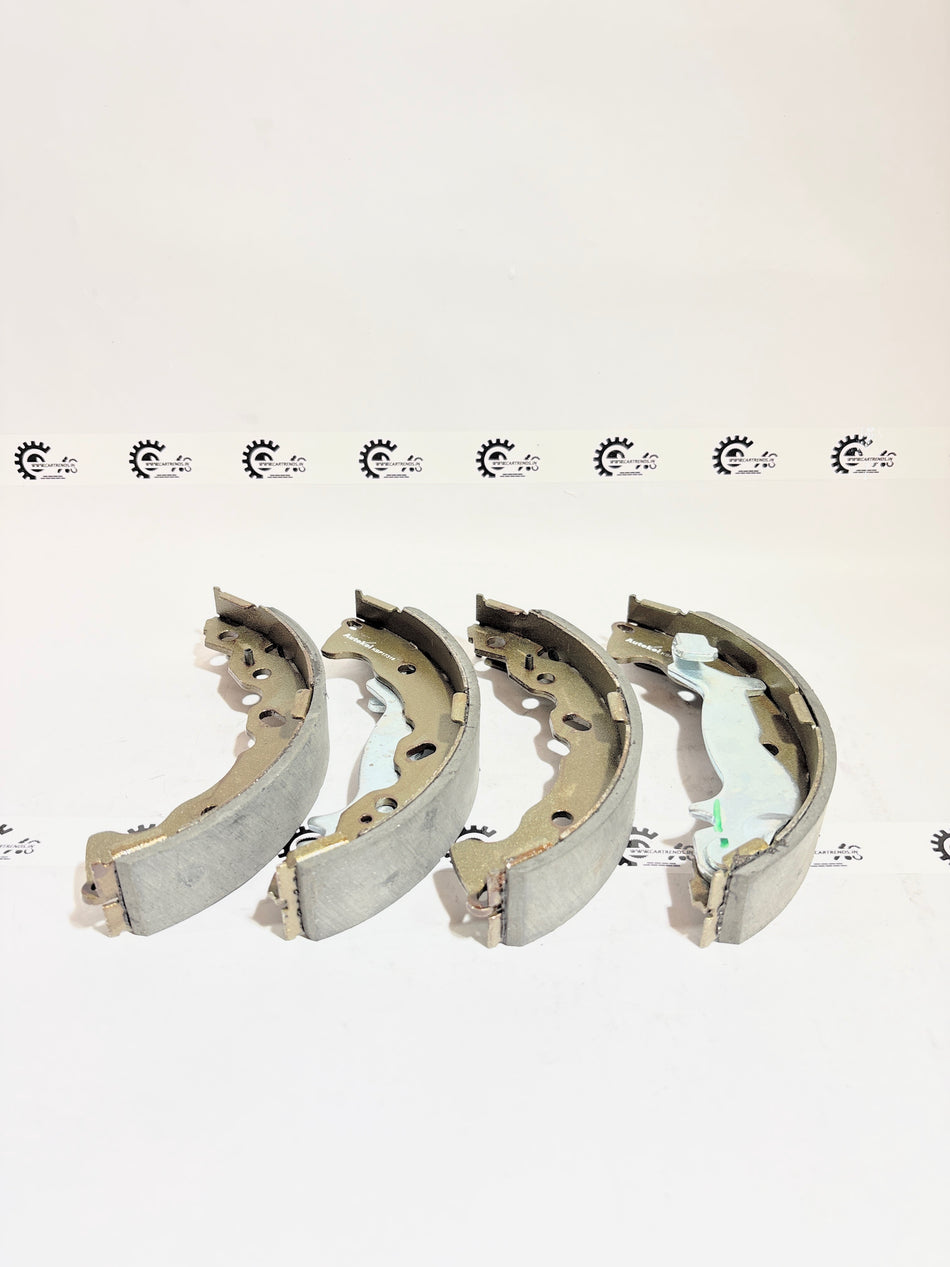 AUTOKOI brake pads and shoe KBPF17316 for vehicle braking system, showing the set of brake components with detailed surface texture.