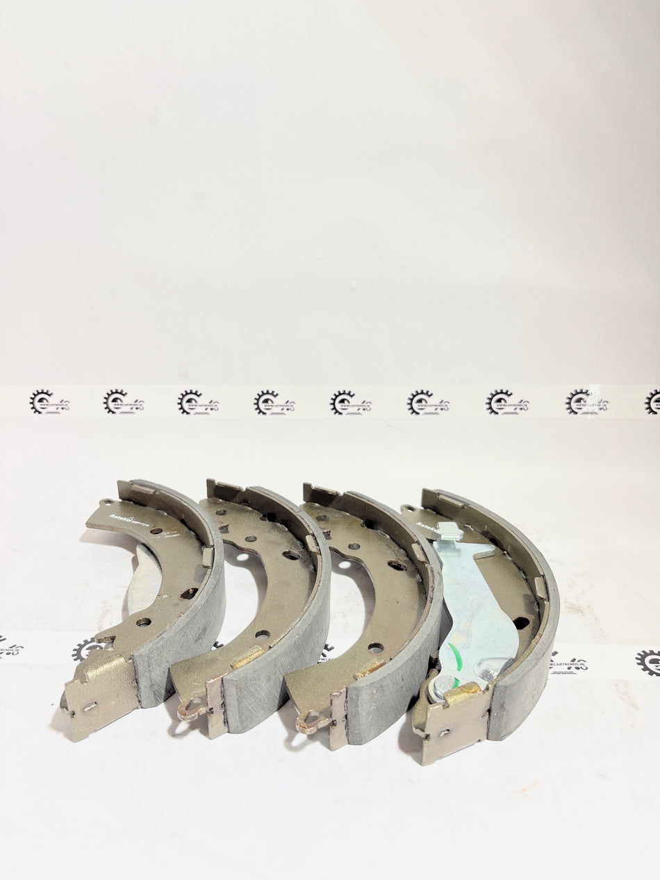 AUTOKOI brake pads and shoe KBPF17319, automotive replacement parts, shown in close-up with details of the brake components.