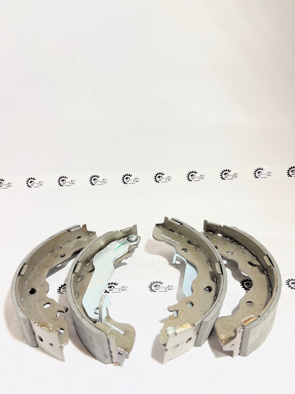 AUTOKOI brake pads and shoe KBPF17320, automotive brake components with detailed surface texture and fitting edges.