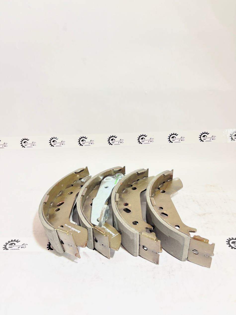 AUTOKOI brake pads and shoe KBPF17322, automotive brake components with detailed metal and rubber parts visible.