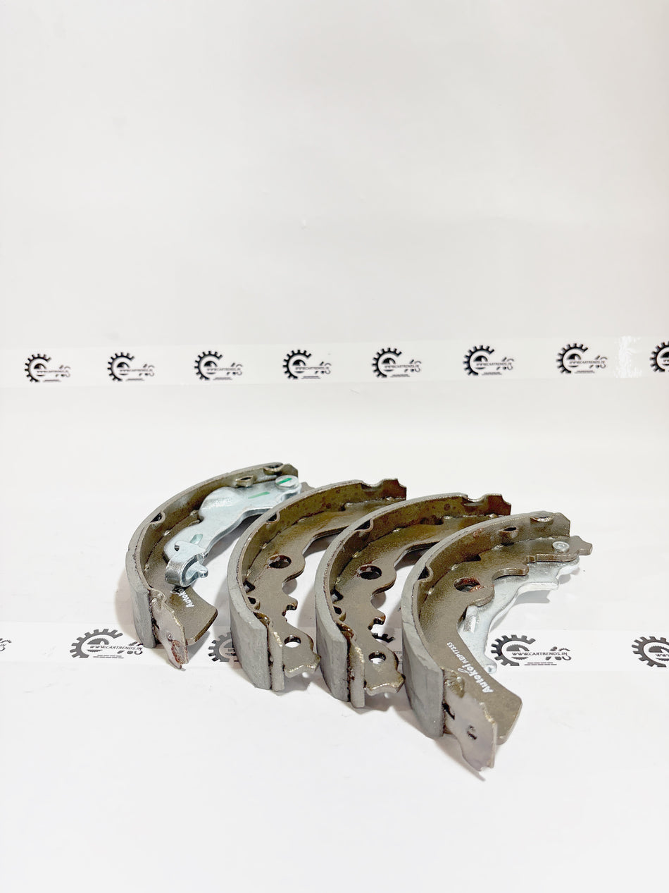 AUTOKOI brake pads and shoe KBPF17353, automotive brake components with detailed surface texture and mounting features.