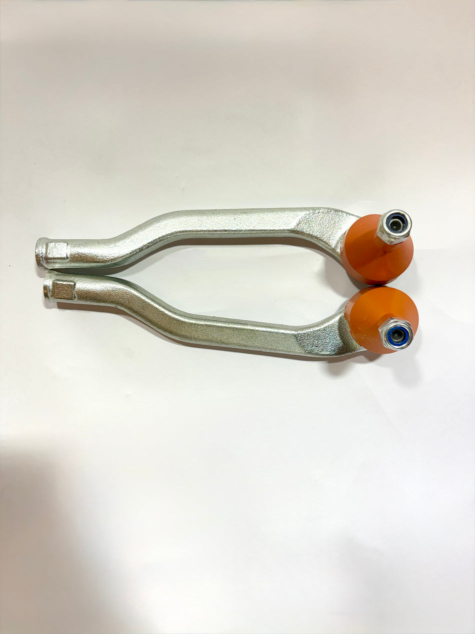 AUTOKOI Duster tie rod end assembly pair, automotive steering components, with visible metal joints and protective rubber boots.