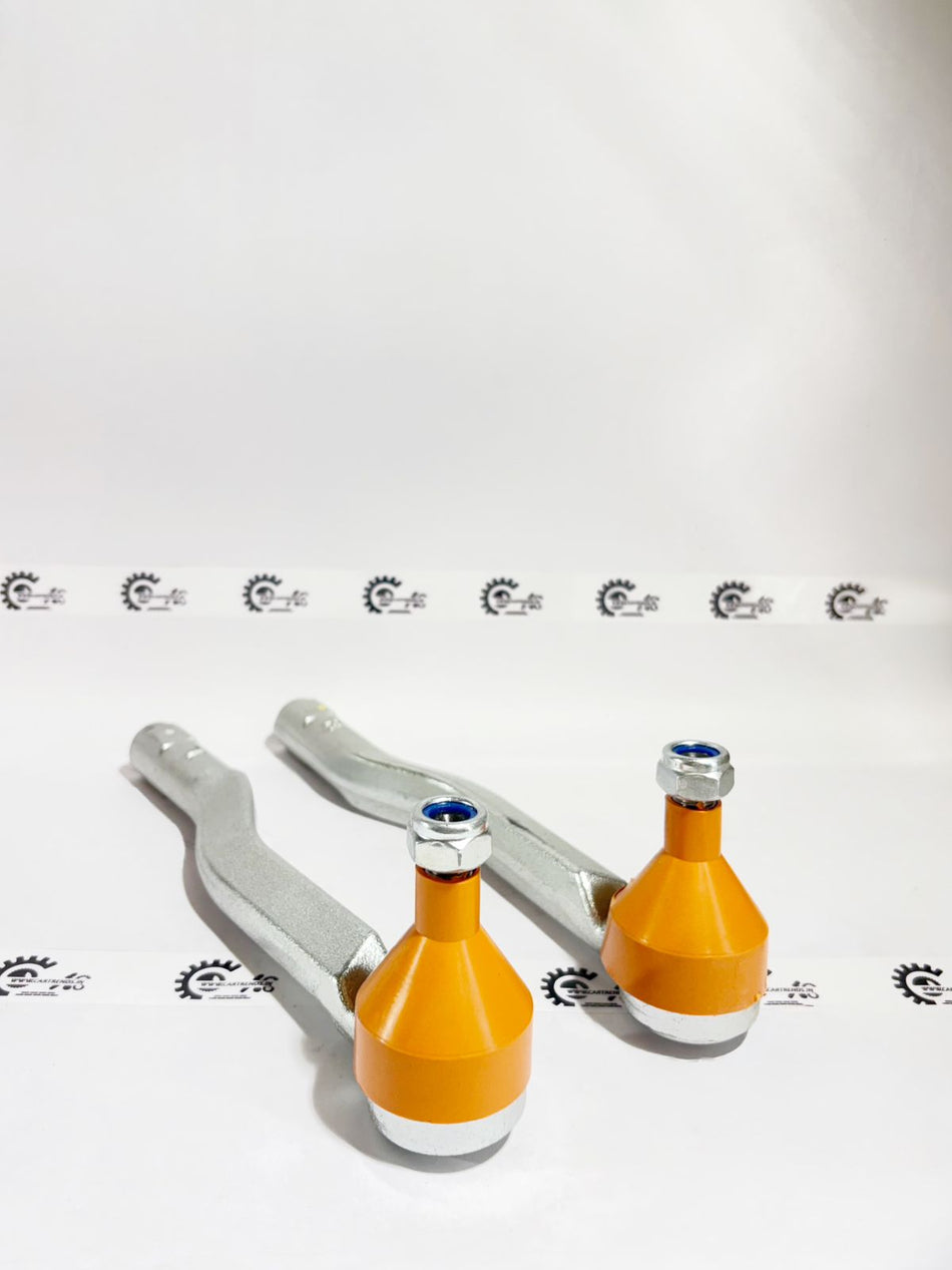 Pair of AUTOKOI Punch Tie Rod End Assemblies, sturdy automotive steering components with durable construction.