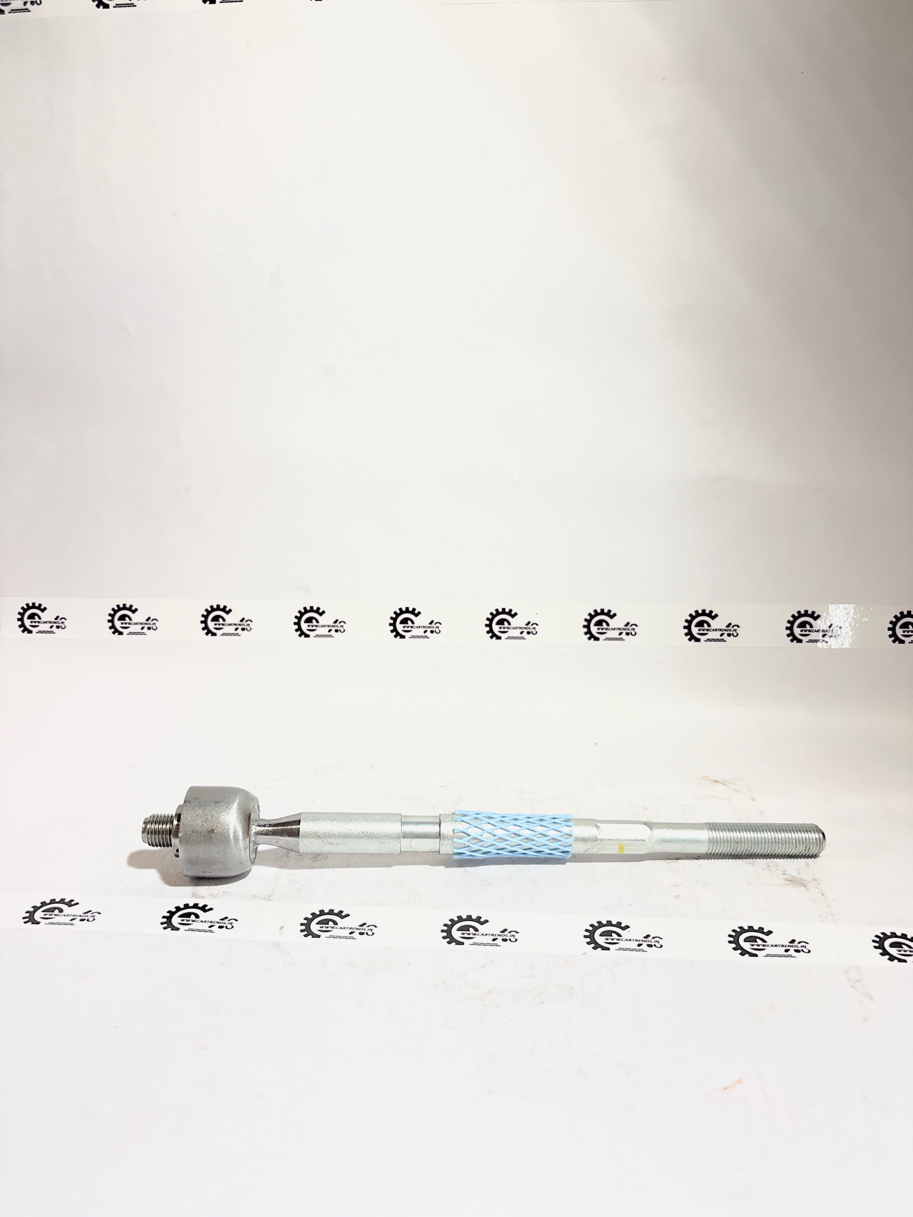 AUTOKOI Rack End Assembly KFOF12015 showing metallic components and mounting points for vehicle suspension repair.