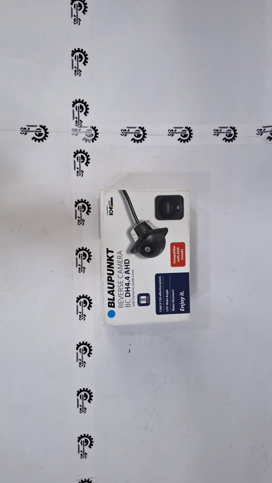 Blaupunkt BC DH4.4 AHD reverse camera by CarTrends showing compact black camera with mounting bracket for vehicle rear view.