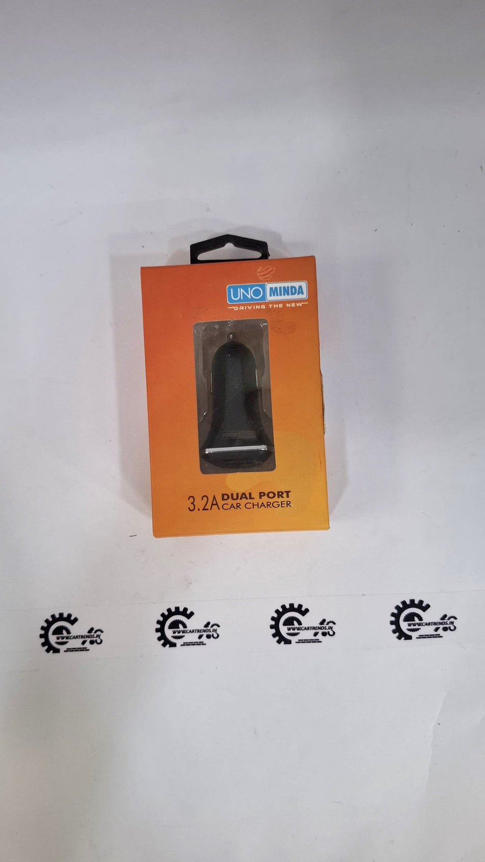 CarTrends car mobile charger connected to a car's dashboard USB port, compact and portable device for charging smartphones on the go.