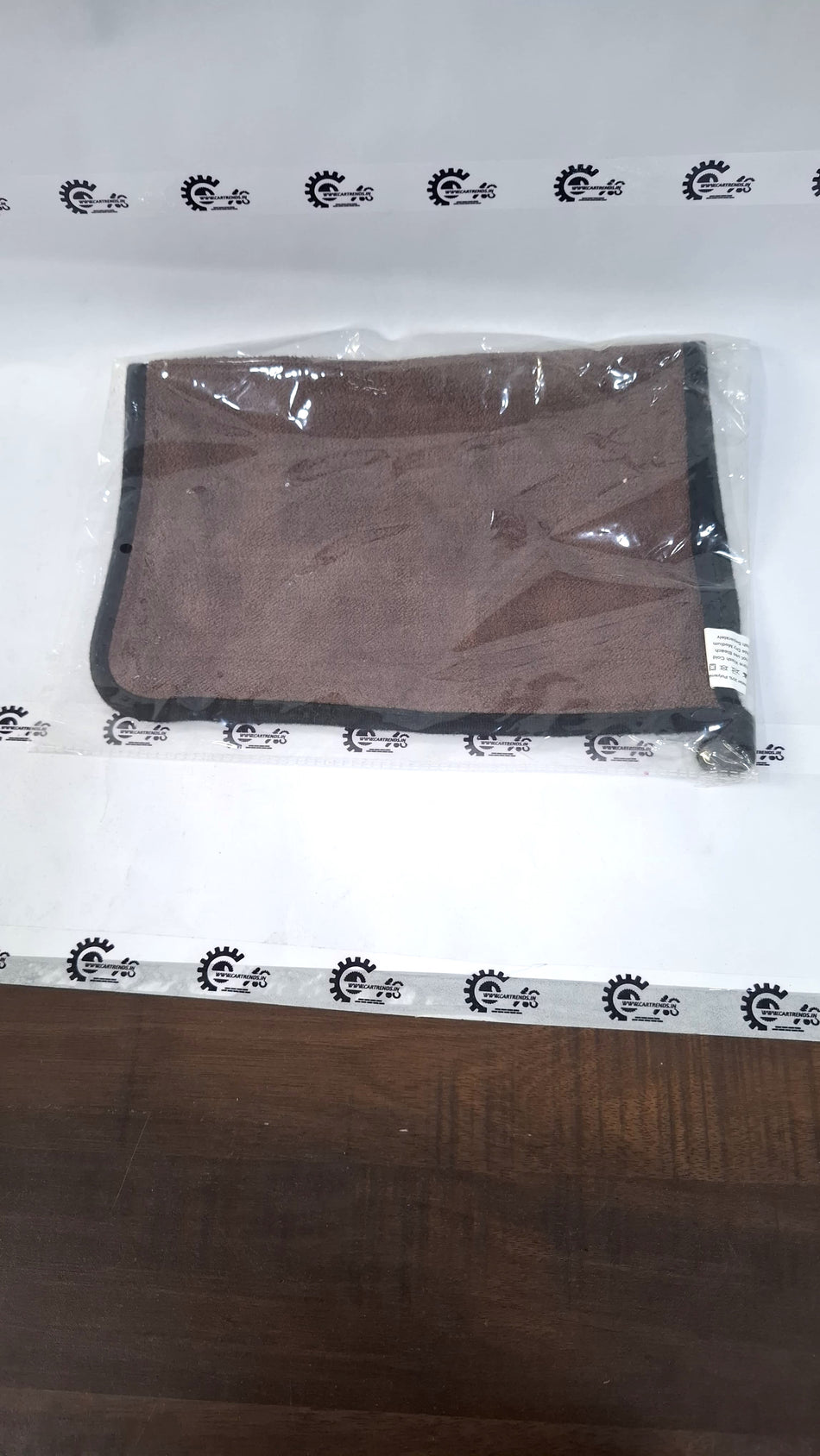 CarTrends cleaning towel shown on a surface, soft fabric ideal for car detailing and cleaning tasks.