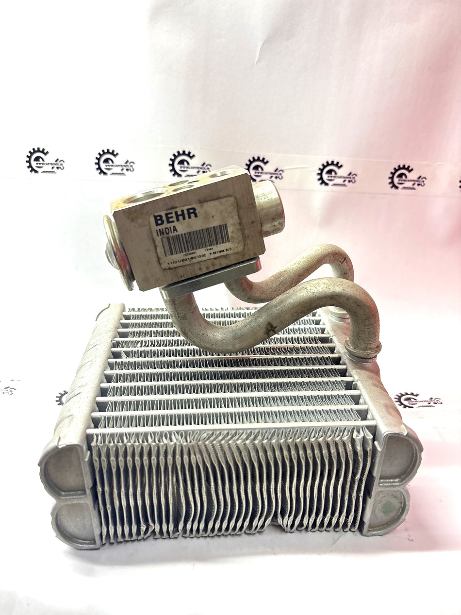 CarTrends evaporator assembly for vehicle air conditioning system, showing metal components and connection points