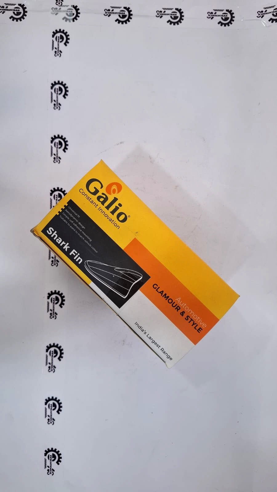 Galio universal shark fin automotive antenna by CarTrends mounted on a car roof for improved radio signal reception.