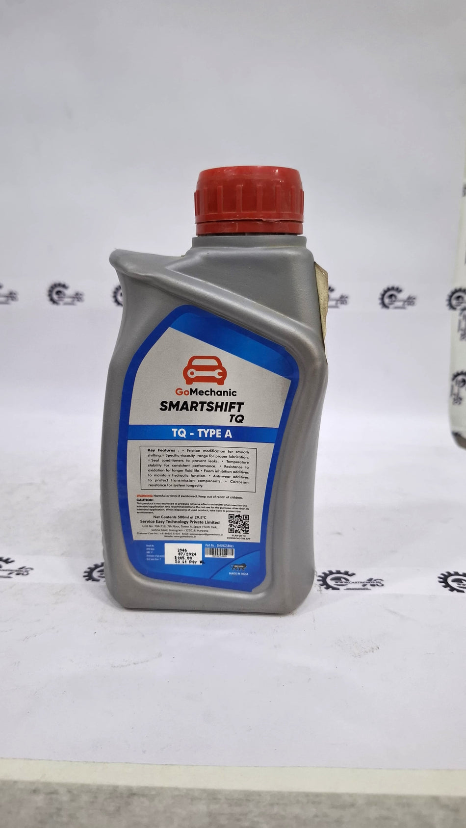 CarTrends GoMechanic Smartshift TQ Type A automatic transmission and power steering fluid in a container.