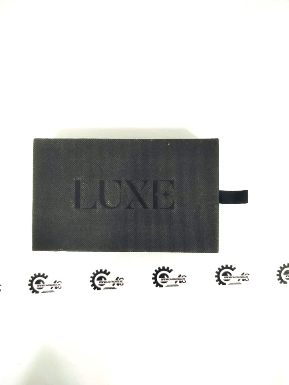 CarTrends Luxe Premium key cover in black with textured finish, designed to protect and stylishly encase car keys.
