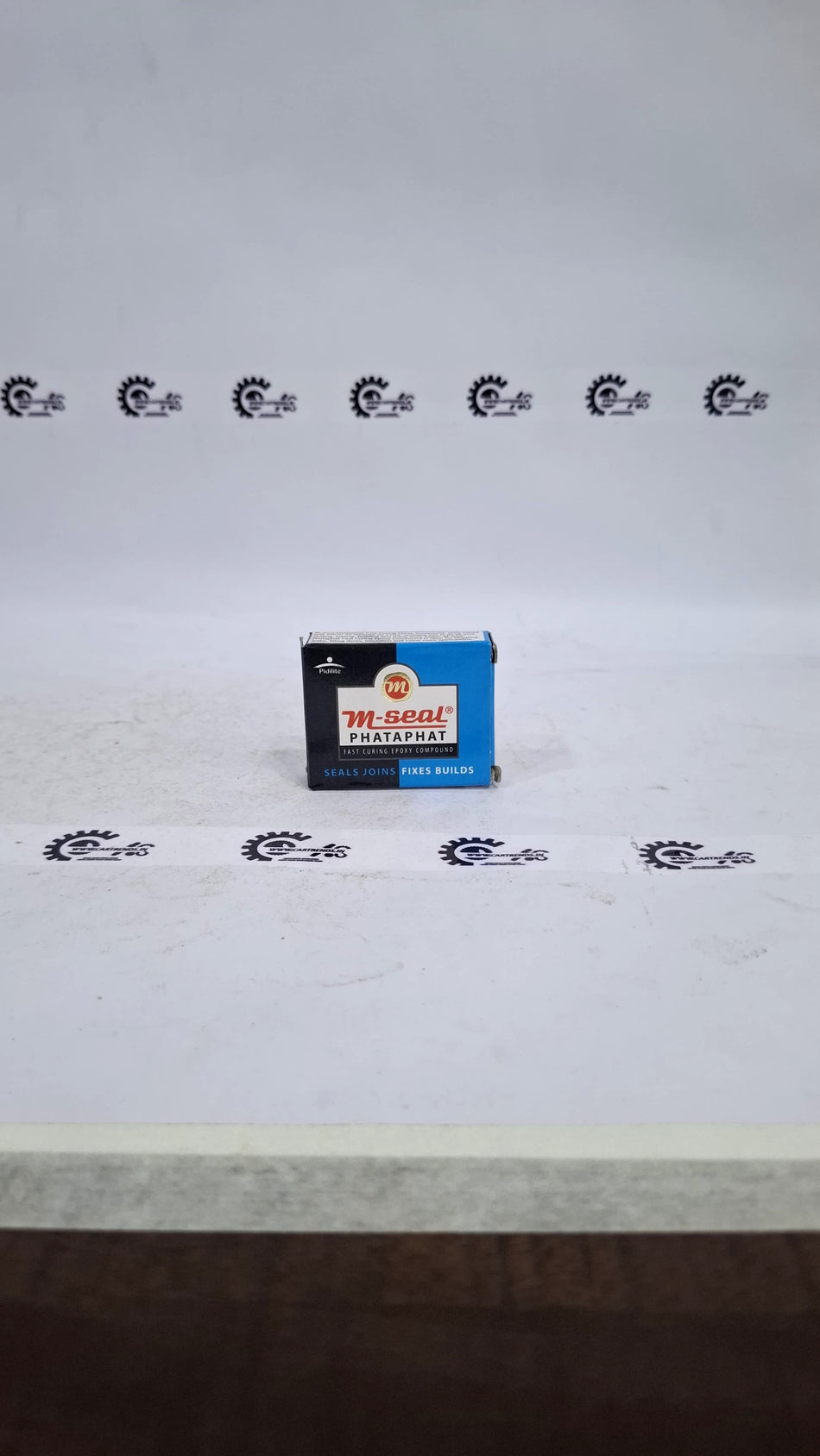 CarTrends M-SEAL RC-H65412B*04 automotive sealant tube with black cap and label showing product details.