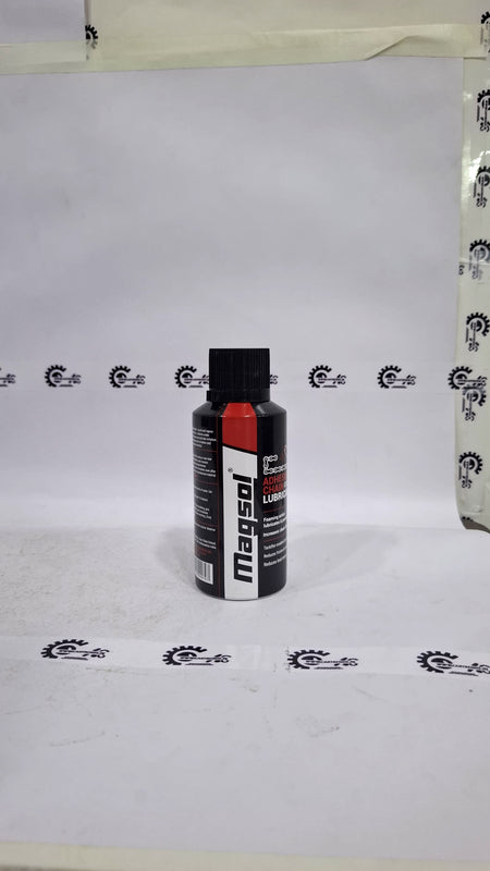 CarTrends Magsol Adhesive Chain Lubricant spray applied to a motorcycle chain, showcasing its effective lubrication properties.