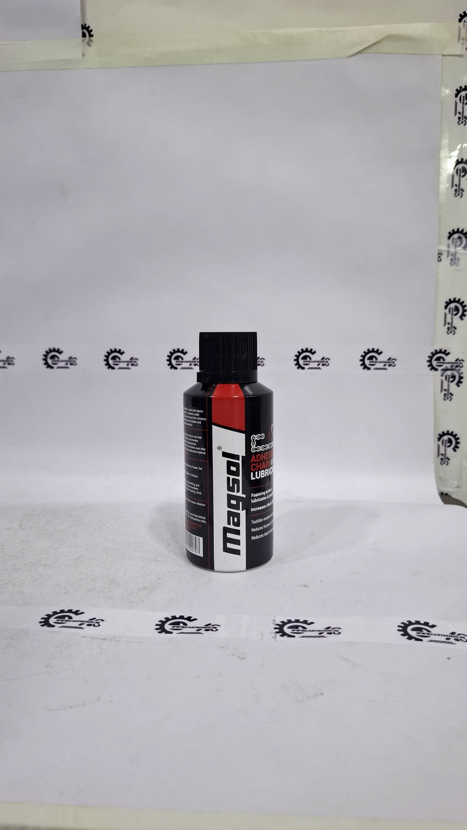 CarTrends Magsol Adhesive Chain Lubricant spray applied to a motorcycle chain, showcasing its effective lubrication properties.