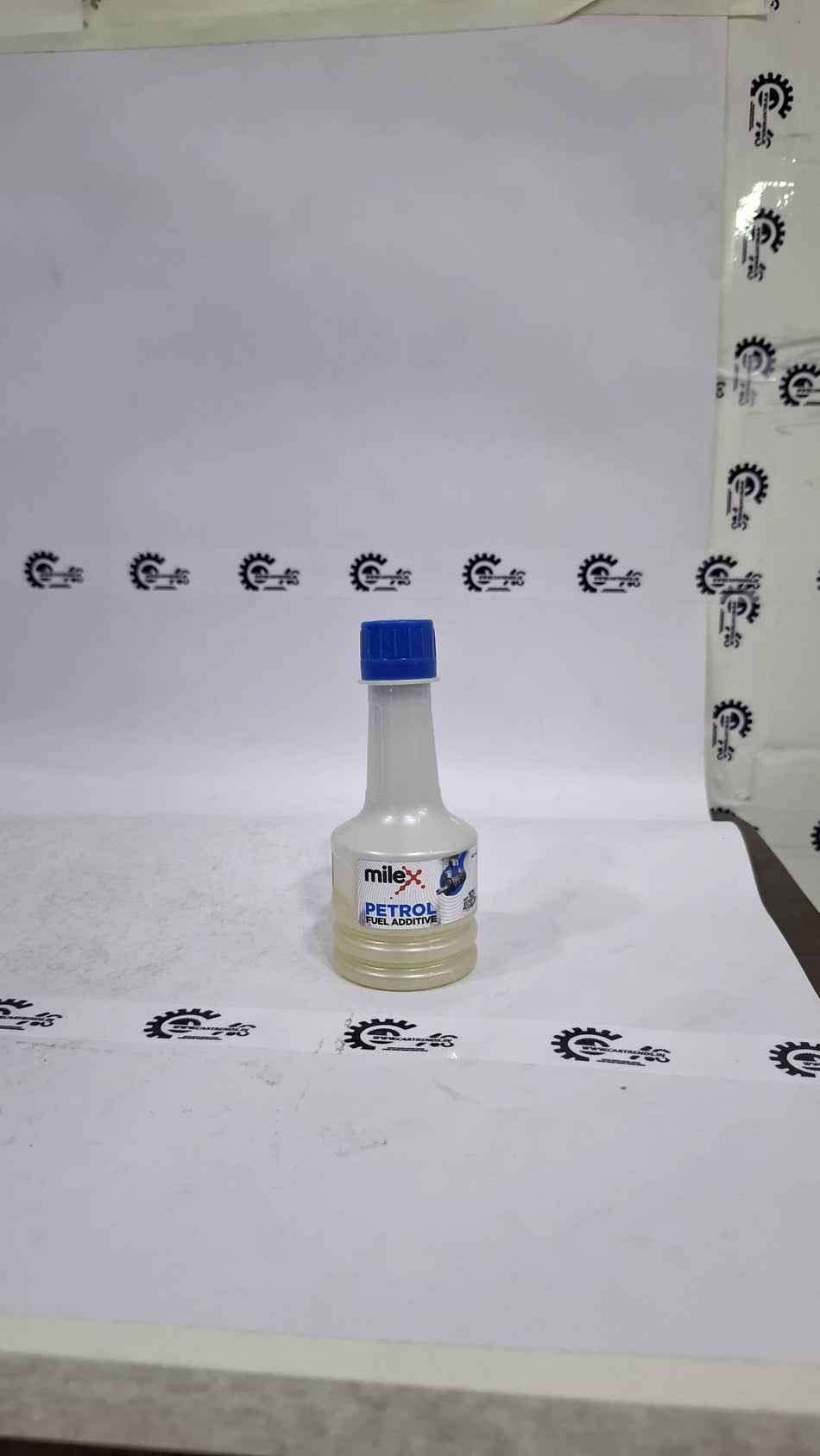 CarTrends Milex Petrol Fuel Additive bottle showing label and orange cap, designed to improve fuel efficiency and engine performance.