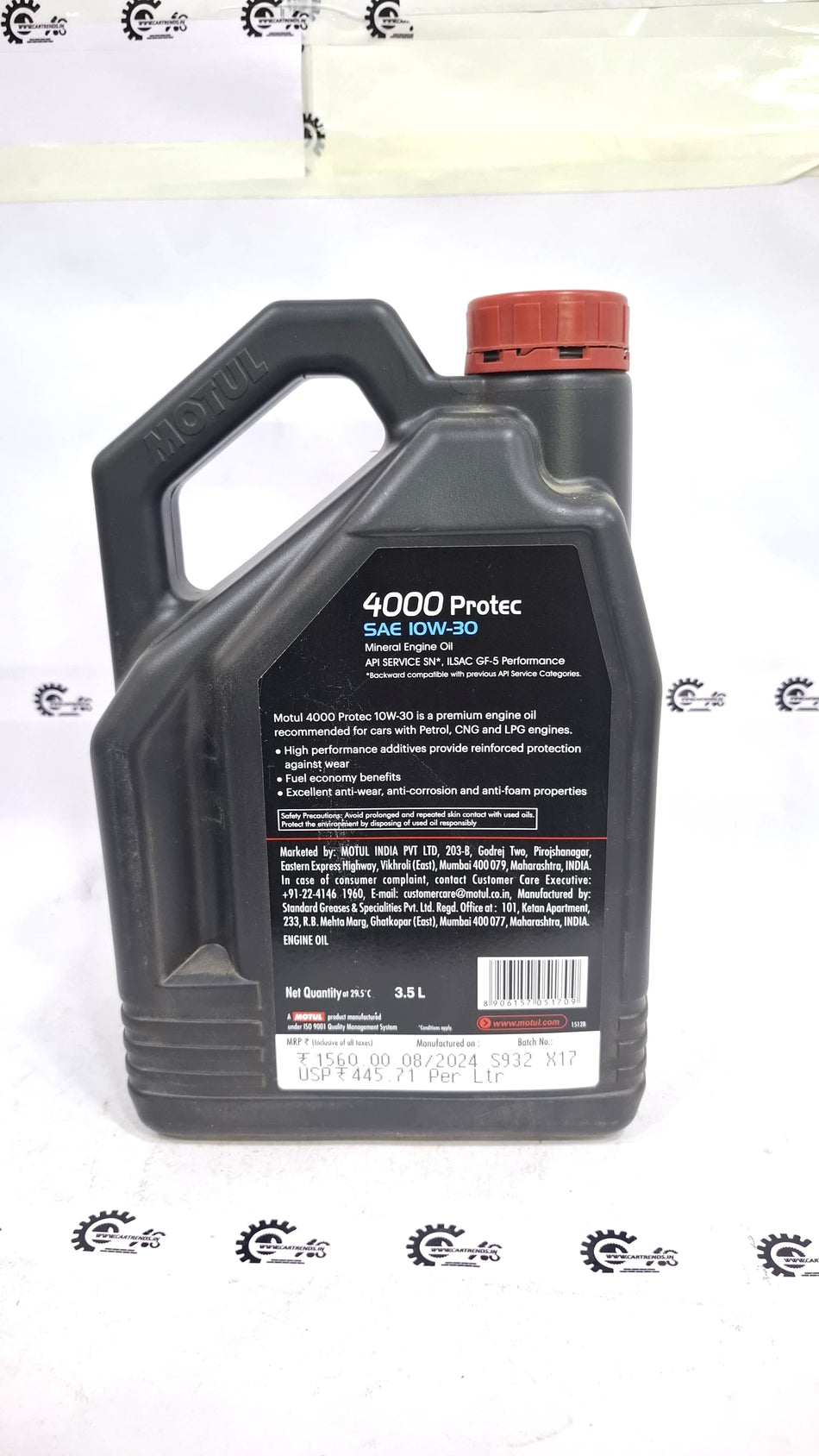 Motor oil bottle labeled Motul 4000 Protec 10W-30 by CarTrends, featuring a black and yellow container with product details.