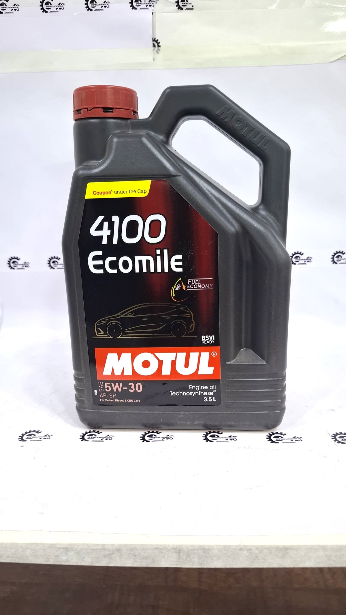CarTrends Motul 4100 Ecomile 5W-30 engine oil bottle with label and cap, designed for vehicle engine lubrication.