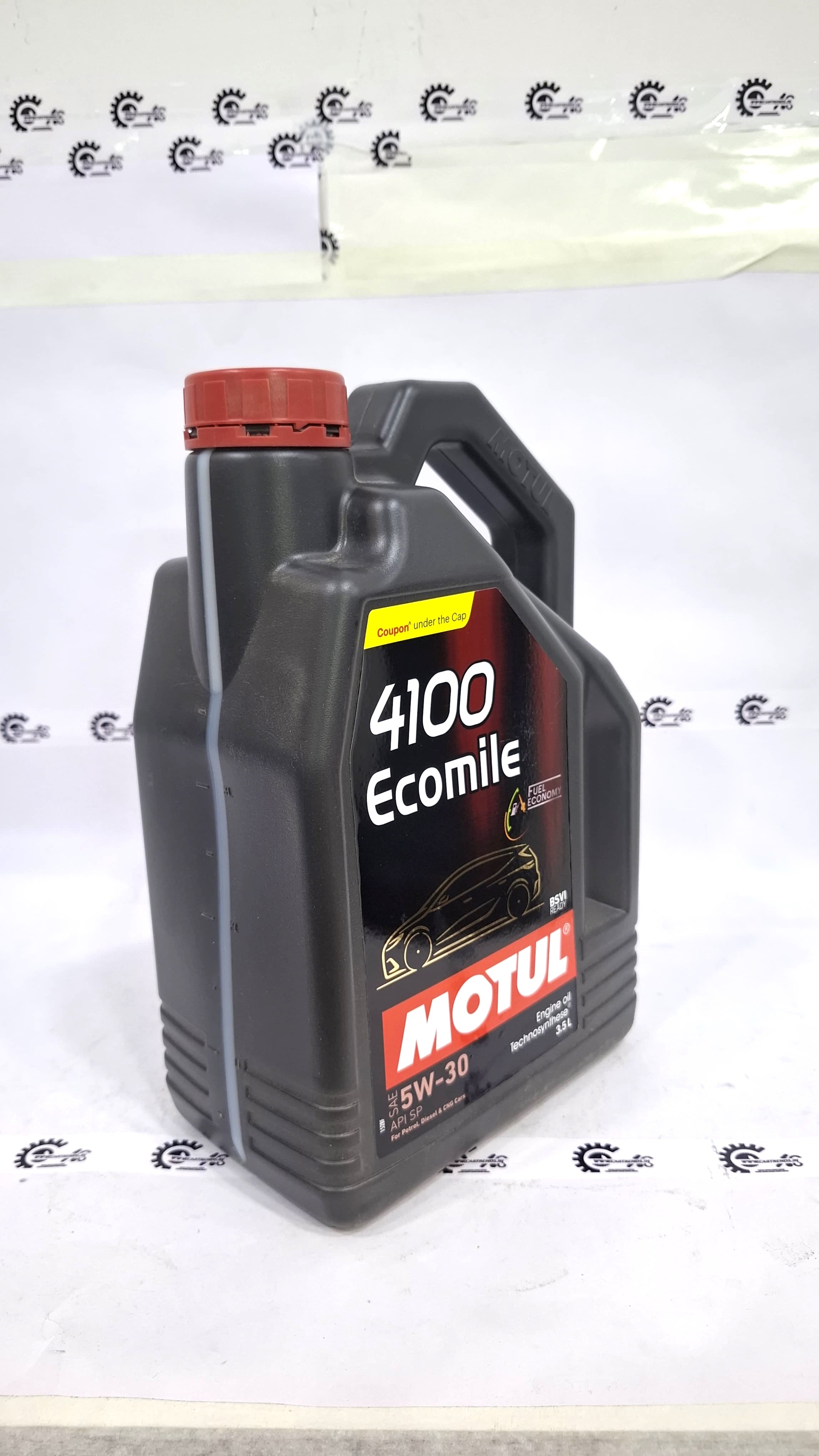 CarTrends Motul 4100 Ecomile 5W-30 engine oil bottle showing label and cap on a plain background.