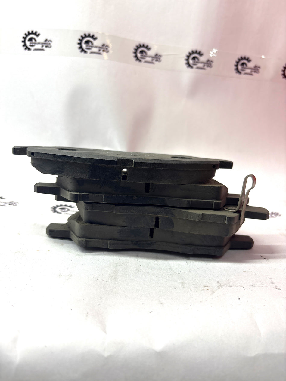 CarTrends disc brake pad kit with multiple brake pads and hardware for vehicle braking system.