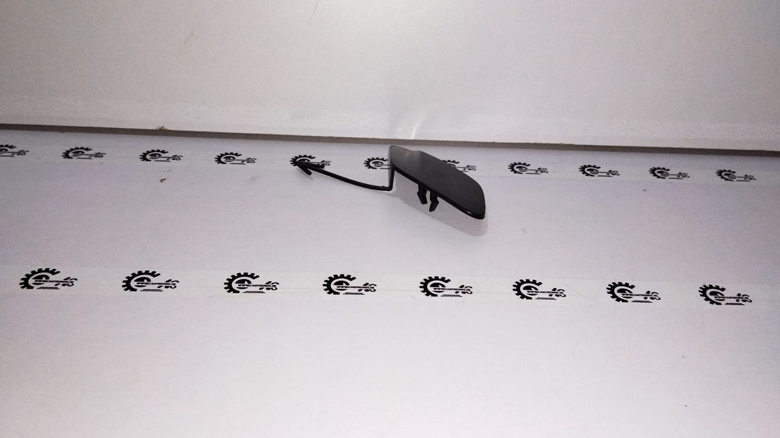 Ford Figo Aspire towing cap for front bumper by CarTrends, showing the black plastic cover on the vehicle's front bumper.