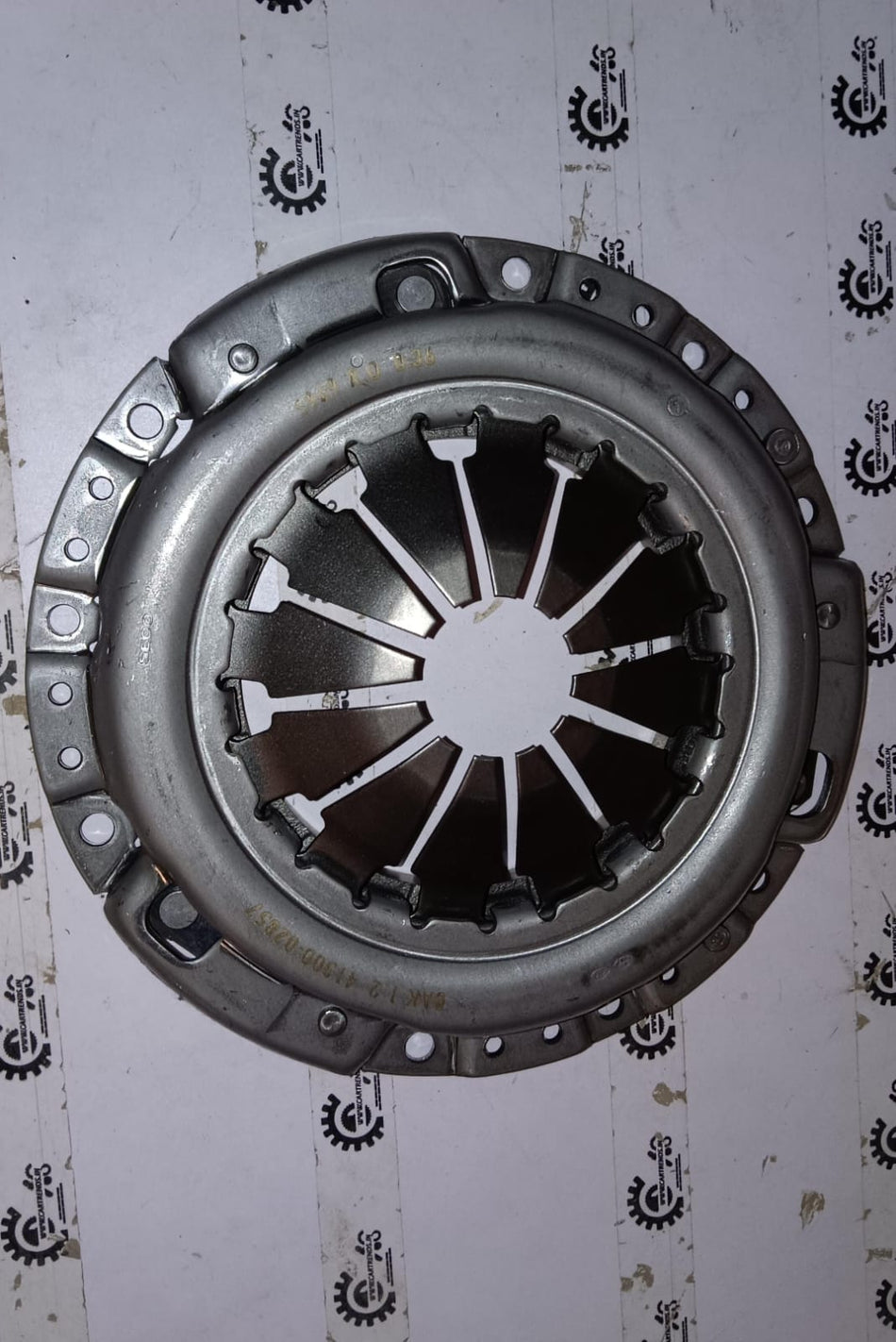 Hyundai Xcent and i10 Grand petrol pressure plate by CarTrends, showing the metal component with mounting holes and clutch surface.