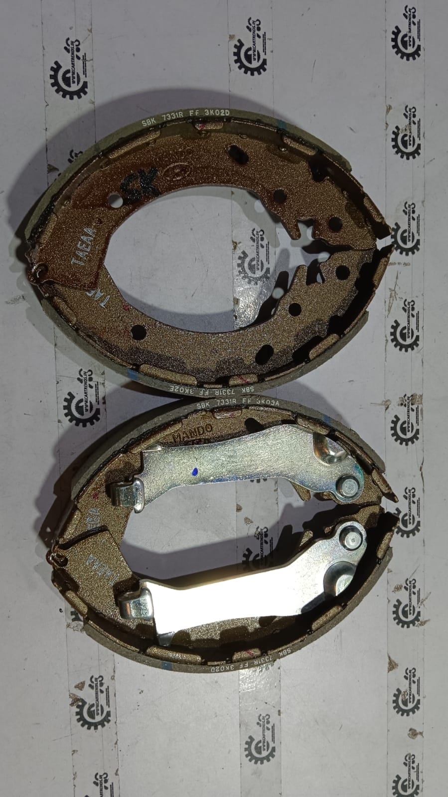 Hyundai Verna brake shoe by CarTrends, showing the shoe's shape and material for vehicle braking system replacement.