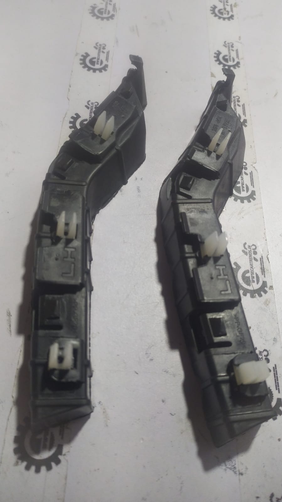 Hyundai Eon front left bumper bracket by CarTrends, car part with mounting points and structural support.