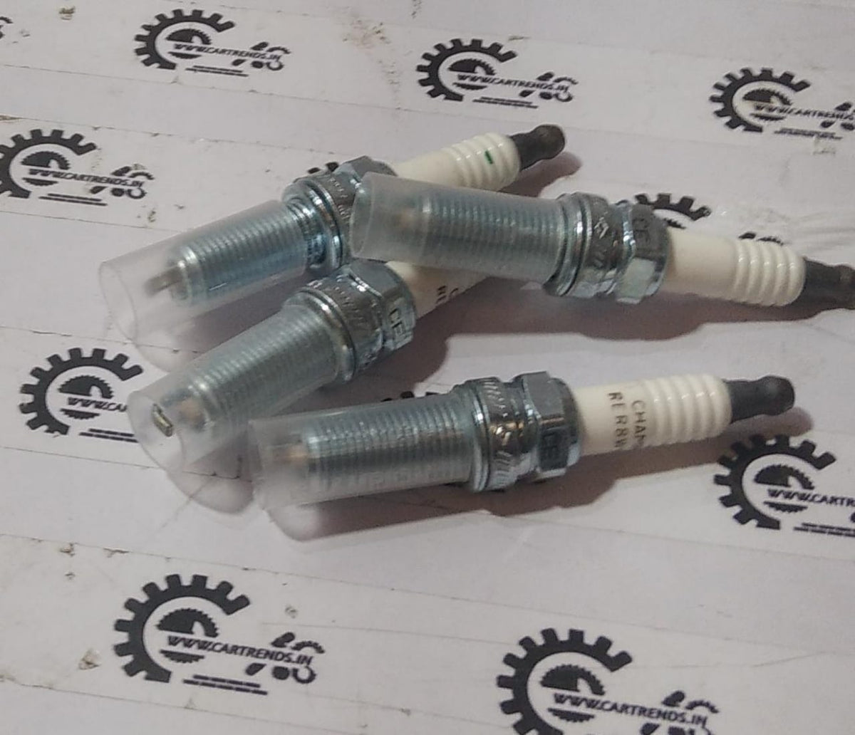 Hyundai CarTrends Spark Plug for i20 Elite Verna Fluidic, automotive spare part, close-up of the ignition component