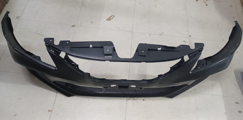 Front bumper for Maruti Baleno by CarTrends, shown in a close-up image highlighting the vehicle's bumper design and mounting points.
